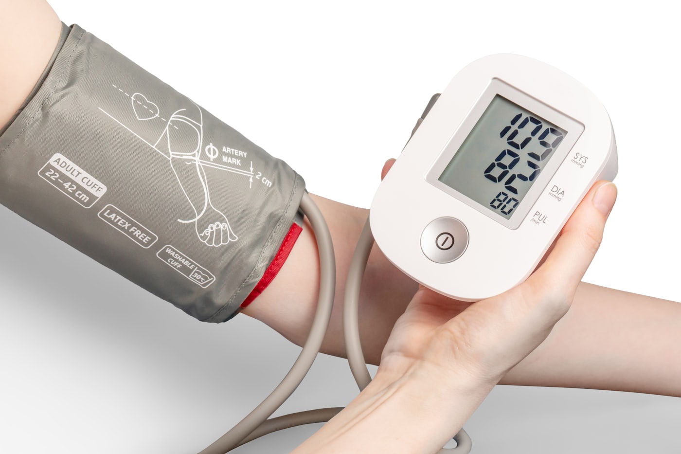 A person using a digital blood pressure monitor