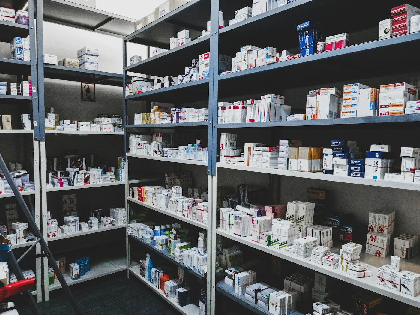 Shelves stocked with medicine boxes